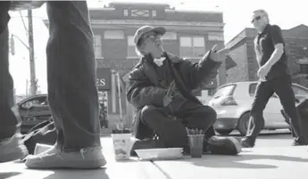  ?? JIM RANKIN/TORONTO STAR ?? Wayne “Hollywood” Joice is back selling pens and making people smile at the corner of Queen St. E. and Lee Ave.