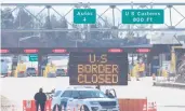  ?? LARS HAGBERG/AFP ?? A sign says that the border is closed at the U.S.-Canada border in March in Lansdowne, Ontario.