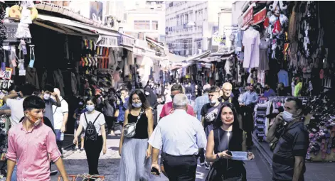  ??  ?? People shop in the Eminönü district in Istanbul, Turkey, Sept. 24, 2020.