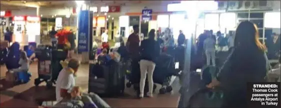  ??  ?? STRANDED: Thomas Cook passengers at Antalya Airport in Turkey