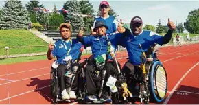  ??  ?? Three thumbs-up: Archery coach Tan Peng Loon (behind) with (from left) Mejar Yuhaizam Yahaya, Mohd Zafi Rahman Mat Saleh and K. Morogen.