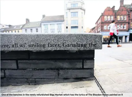  ??  ?? One of the benches in the newly refurbishe­d Bigg Market which has the lyrics of The Blaydon Races painted on it