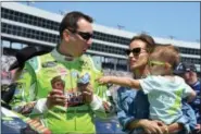  ?? RANDY HOLT — THE ASSOCIATED PRESS ?? Kyle Busch jokes with his son Brexton, right, as he talks with his wife, Samantha, center, on pit road before the NASCAR Cup Series auto race at Texas Motor Speedway in Fort Worth, Texas, Sunday.