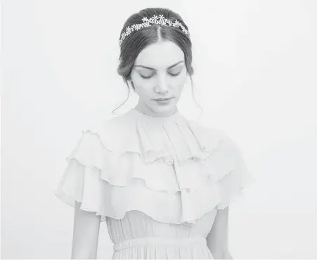  ?? JENNIFER BEHR ?? A model wears a bridal headpiece called Aster Circlet which was designed by Jennifer Behr.