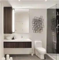  ?? COURTESY OF HUMA DESIGN ?? An artist’s rendering shows one of the stylish bathrooms in Le Se7t condos, which will include low-flow faucets and toilets.