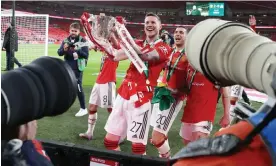  ?? Wout Weghorst celebrates with the Carabao Cup after Manchester United’s victory over Newcastle. Photograph: Jacques Feeney/Offside/Getty Images ??