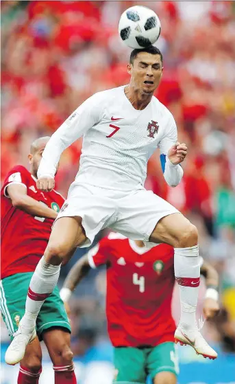  ?? FRANCISCO SECO/THE ASSOCIATED PRESS ?? Portugal star Cristiano Ronaldo continues to make up for his team’s ordinary play with the only goal of the match Wednesday in a 1-0 win over Morocco at Luzhniki Stadium in Moscow.