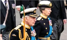  ?? Photograph: Sean Smith/The Guardian ?? King Charles III and, behind him, Princess Anne follow their mother’s coffin after her funeral service at Westminste­r Abbey.