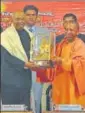  ?? HTPHOTO ?? ▪ Chief minister Yogi Adityanath presenting a memento to President Ram Nath Kovind in Gorakhpur on Monday.