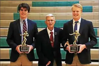  ??  ?? Tom DeLucia (center) presents the award named after his late son, Michael, to Joe DiGregorio (left) of Archmere Academy and William Hoffman of St. Mark’s High.