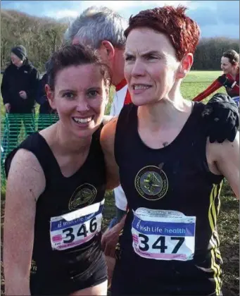  ??  ?? Dunleer AC’s Karen Costello (right) celebrates her victory with training partner Nicola Welsh.