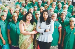  ?? —DC ?? 26-year-old Likitha Bhanu along with her mother Padmaja Bhanu strikes a pose with staff at the Terra Greens Organic Food Company establishe­d by the duo in Hyderabad in 2013.