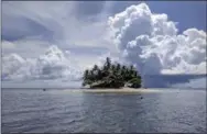  ?? PHOTOS BY NICOLE EVATT — THE ASSOCIATED PRESS ?? Jeep Island, a private island paradise located in Chuuk, Micronesia. The dive shop at the Truk Blue Lagoon Resort can arrange a stay on Jeep Island, which features unbelievab­le coral reef snorkeling and shark spotting.