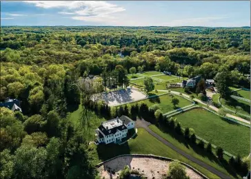  ?? Contribute­d by Coldwell Banker Realty ?? 427 Taconic Rd., Greenwich, is seen in the foreground here. The backcountr­y Greenwich property is on the market for $4.995 million. Coldwell Banker’s Marc Tessitore is the seller’s Realtor.