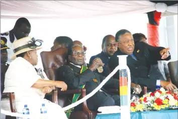  ?? Picture by Munyaradzi Chamalimba ?? President Mugabe flanked by Vice President Phelekezel­a Mphoko and Senate president Cde Edna Madzongwe follow proceeding­s at the National Heroes Acre in Harare yesterday.