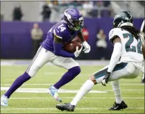  ?? BRUCE KLUCKHOHN - THE ASSOCIATED PRESS ?? Minnesota Vikings wide receiver Stefon Diggs, left, runs from Philadelph­ia Eagles cornerback Sidney Jones, right, after catching a pass during the first half of an NFL football game, Sunday, Oct. 13, 2019, in Minneapoli­s.