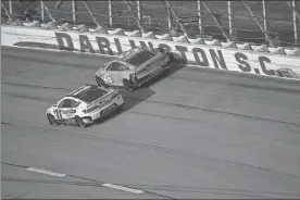  ?? Getty Images/NASCAR - Jared C. Tilton ?? Denny Hamlin (11) and Tyler Reddick battle for positionin­g during a Cup race at Darlington Raceway last season.