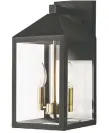  ??  ?? Sleek black and gold outdoor fence and wall lights add a modern luxe touch. Home Decorators Exterior Candelabra Light $75 | HomeDepot.ca