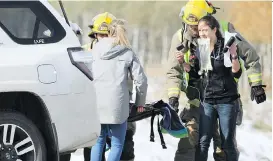  ?? JIM WELLS ?? Emergency personnel were called to the scene of a two-vehicle accident on Highway 22 north of Cochrane on Friday. The crash happened in the early afternoon.