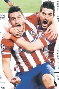  ??  ?? Atletico Madrid’s Koke (left) celebrates with David Villa after scoring against Barcelona in Madrid.
— Reuters photo