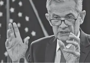  ?? SUSAN WALSH/AP ?? Jerome Powell has the Federal Reserve, which will likely begin slowing the pace of its monthly bond purchases and projects short-term rate hikes out to 2024.