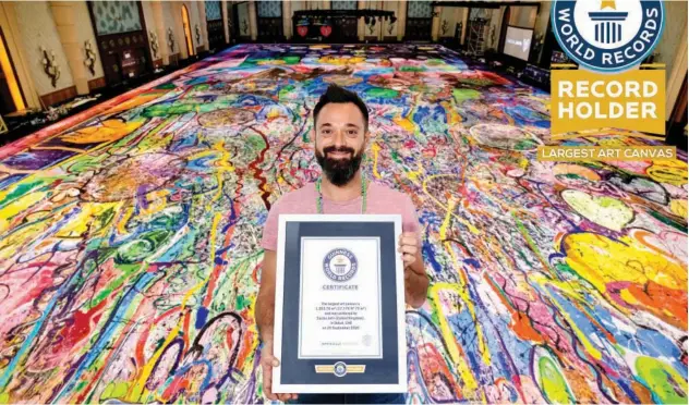  ??  ?? ↑
Sacha Jafri has officially set the Guinness World Record title for ‘The Largest Art Canvas’ in the world, with his painting ‘The Journey of Humanity’.