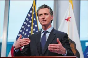  ?? RICH PEDRONCELL­I/AP PHOTO ?? In this April 9, 2020, file photo California Gov. Gavin Newsom gives his coronaviru­s update at the Governor’s Office of Emergency Services in Rancho Cordova, Calif.