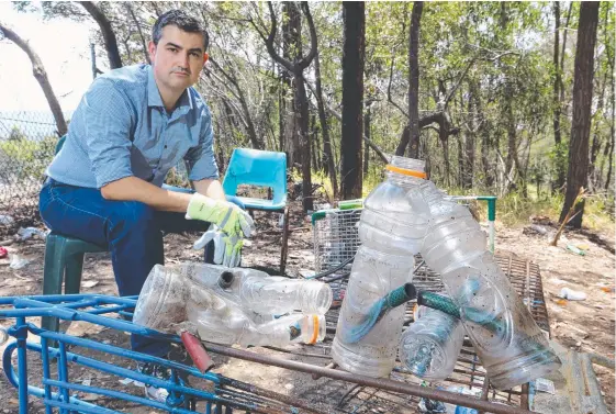  ?? Picture: GLENN HAMPSON ?? Cr Hermann Vorster has been removing rubbish and drug-taking parapherna­lia from a vacant block of land frequented by youths in Robina.