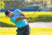  ?? JOHN MINCHILLO AP ?? Patrick Reed, playing a shot on second fairway, was happy to shoot an even-par 70 for a one-shot lead.