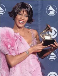  ?? AFP VIA GETTY IMAGES ?? The vocals in “I Wanna Dance With Somebody” will be purely Whitney Houston, shown in 2000 at the Grammy Awards.