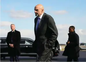  ?? The Associated Press ?? ■ Sen. John Fetterman, D-PA., walks to a motorcade vehicle after stepping off Air Force One behind President Joe Biden on Feb. 3 at Philadelph­ia Internatio­nal Airport in Philadelph­ia. On Thursday, Fetterman’s office announced that the senator had checked himself into the hospital for clinical depression.