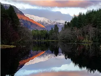  ??  ?? All is calm: Top, Lanark shrouded in mist yesterday. Above, Glencoe Lochan