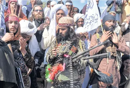  ??  ?? Taliban militants and villagers attend a gathering as they celebrate the peace deal and their victory against the US in Laghman province earlier this month.