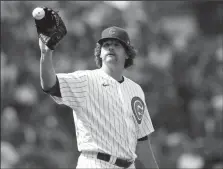  ?? JOHN J. KIM/CHICAGO TRIBUNE ?? Cubs reliever Andrew Chafin has a ball thrown back to him after giving up two runs in the seventh inning against the Diamondbac­ks on Saturday at Wrigley Field.