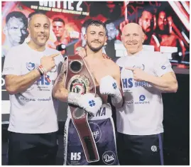  ??  ?? CHAMPION Mikey McKinson is flanked by his father and trainer Michael Ballingall (left) and Gavin Jones. Above - big fight action