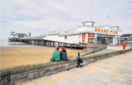  ??  ?? Weston-super-Mare seafront, and a closed Grand Pier, during lockdown in April