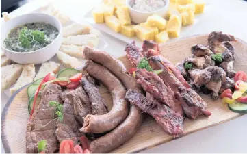  ?? Picture: VAL ADAMSON ?? At shisanyama­s your meat is served on a meat board, or isithebe.