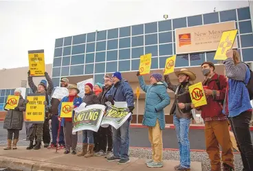  ?? JON AUSTRIA / JOURNAL ?? Protestors demonstrat­ed outside New Mexico Gas Co.’s headquarte­rs in January against a proposed liquefied natural gas facility in Rio Rancho. New Mexico’s Public Regulation Commission in March rejected the $180 million state-of-the-art plant intended to protect against price spikes after hundreds of activists opposed the plant. Opposing LNG plants has become a progressiv­e political cause. But just 10 years ago, New Mexico Democratic Sen. Tom Udall co-sponsored legislatio­n to speed up the review of LNG export facilities.