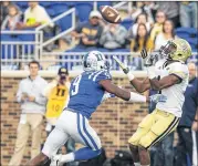  ?? BEN MCKEOWN / AP ?? A-back Qua Searcy, who scored a late, dramatic touchdown, was the hero of Tech’s 28-27 victory last season over Georgia.