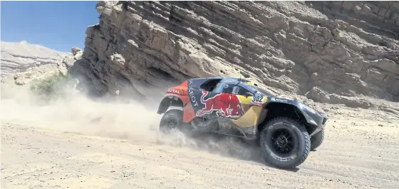  ??  ?? Peugeot’s Stephane Peterhanse­l, and co-driver Jean Paul Cottret, race during the 11th stage of the 2016 Dakar Rally.