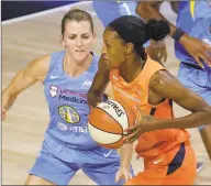  ?? Chris O'Meara / Associated Press ?? Connecticu­t Sun forward DeWanna Bonner (24) drives by Chicago Sky guard Allie Quigley on Friday in Bradenton, Fla.