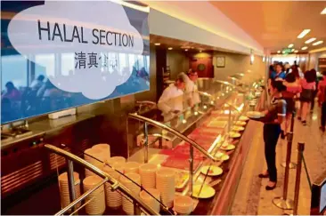  ??  ?? One of Genting Dream’s most popular restaurant­s, The Lido, now offers a dedicated halal buffet section for Muslim guests.