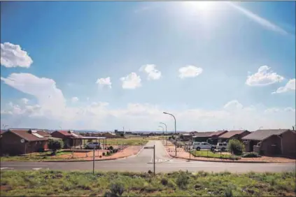  ??  ?? Urban bliss: Recently built houses at Siyathemba (above), a suburb of Kathu, accommodat­es people moved out of Dingleton, where Kumba Iron Ore wants to mine. Anglo’s mines and the solar power industry are creating well-paid jobs for people, but the price of property has shot up.