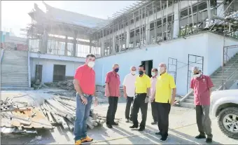  ?? ?? Yong (second left), Lee (front centre), Ting (second right), Yii (back, left) and Tay (back, right) in a photo at the project site.