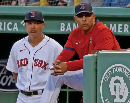  ?? MATT STONE / HErAld STAff filE ?? WAITING GAME: Bench coach Will Venable, left, and manager Alex Cora look on during the first inning against the Minnesota Twins at Fenway Park on Aug. 25.