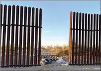  ?? US CUSTOMS AND BORDER PROTECTION VIA AP ?? This photo provided by the U.S. Customs and Border Protection shows a hole cut into Southern California’s border fence with Mexico on Wednesday.