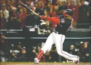  ?? AP/PATRICK SEMANSKY ?? Washington Nationals’ Juan Soto hits an RBI double during the first inning of Game 4 Tuesday.