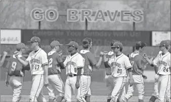  ?? Jeremy Stewart / Rome News-Tribune ?? Players from both Rome High and Cartersvil­le greet each other on the field following their game in the Rome Braves Invitation­al on Saturday at State Mutual Stadium. Cartersvil­le won the game 7-0.