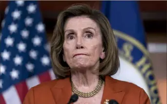  ?? J. Scott Applewhite/Associated Press ?? House Speaker Nancy Pelosi, D-Calif., reacts to the Supreme Court decision overturnin­g Roe v. Wade during a news conference at the U.S. Capitol on Friday.