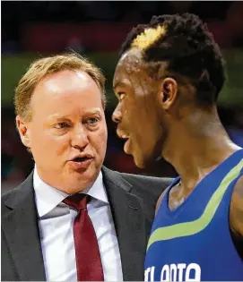  ?? CURTIS COMPTON / CCOMPTON@AJC.COM ?? Former Hawks coach Mike Budenholze­r will return to town today with the Bucks, while Dennis Schroder, who doesn’t have the golden patch in his hair this season, will return Tuesday with the Thunder.